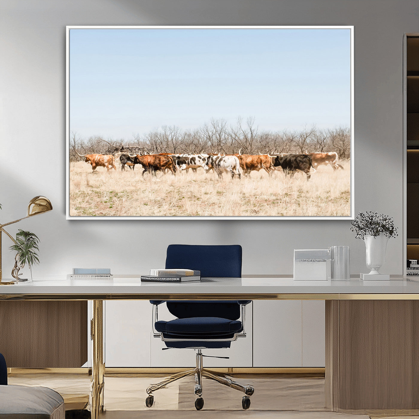 Framed wall art of Texas longhorn cattle walking through a dry, neutral-toned prairie, perfect for rustic farmhouse or western-themed home decor.