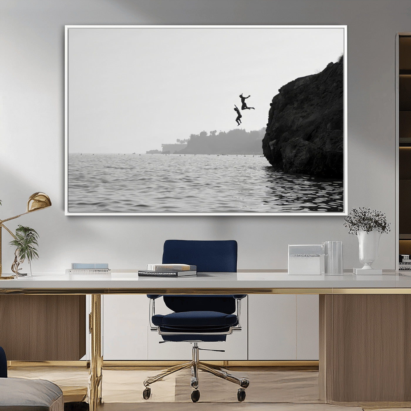 Black and white canvas of two figures cliff jumping into the sea, captured with moody tones, ideal for modern coastal or adventure-themed home decor.   2/2