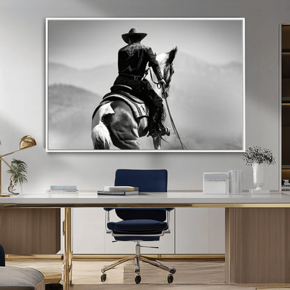 Black and white canvas of a cowboy on horseback with moody tones, perfect for rustic western or country-inspired home decor.