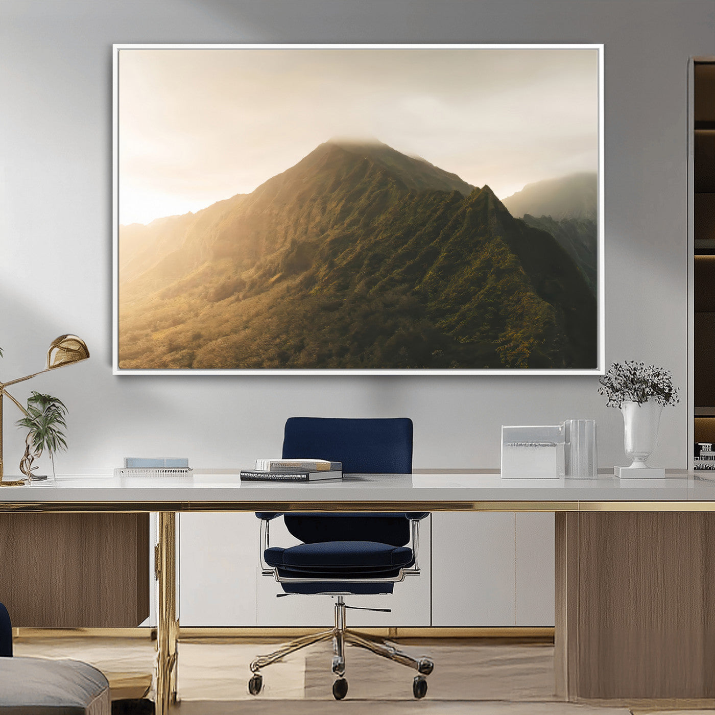 Sunlit mountain peak with mist rolling over its rugged slopes, bathed in golden light, creating a warm and tranquil nature-inspired scene.