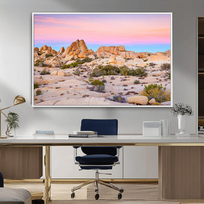 A breathtaking desert landscape featuring rugged rock formations under a vibrant pastel sunset sky, capturing the warmth and serenity of a Southwestern wilderness.