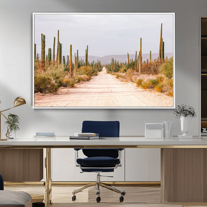 A desert road lined with saguaro cacti under a golden sky, creating a warm southwestern feel, perfect for boho or rustic decor.