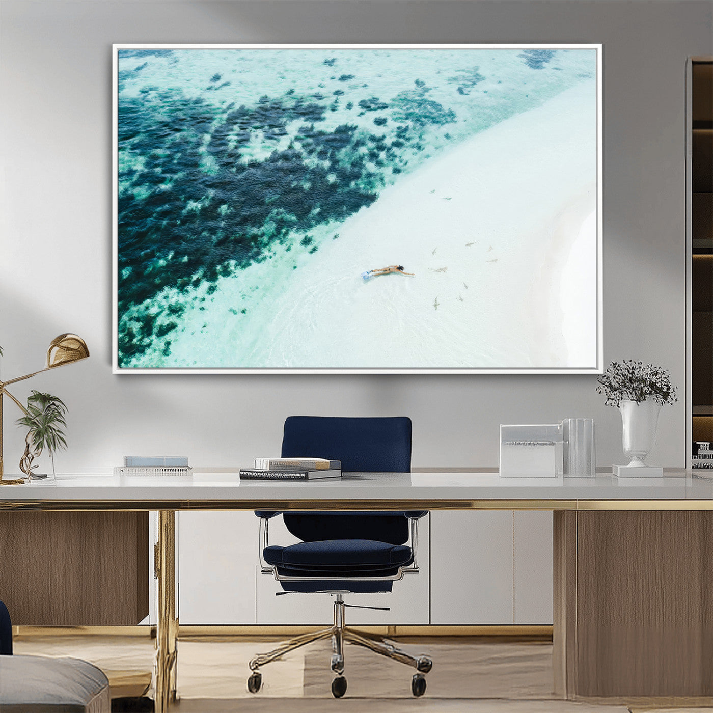 Canvas featuring an aerial view of a swimmer in shallow turquoise waters with coral patterns, ideal for tropical coastal home decor.