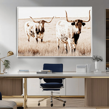 Two Texas longhorn cows standing in a sepia-toned pasture, evoking rustic charm perfect for farmhouse or western country interiors. (