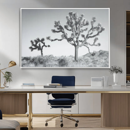 Black and white Joshua tree in a desert landscape with soft light and dry brush, perfect for rustic or minimalist home decor.