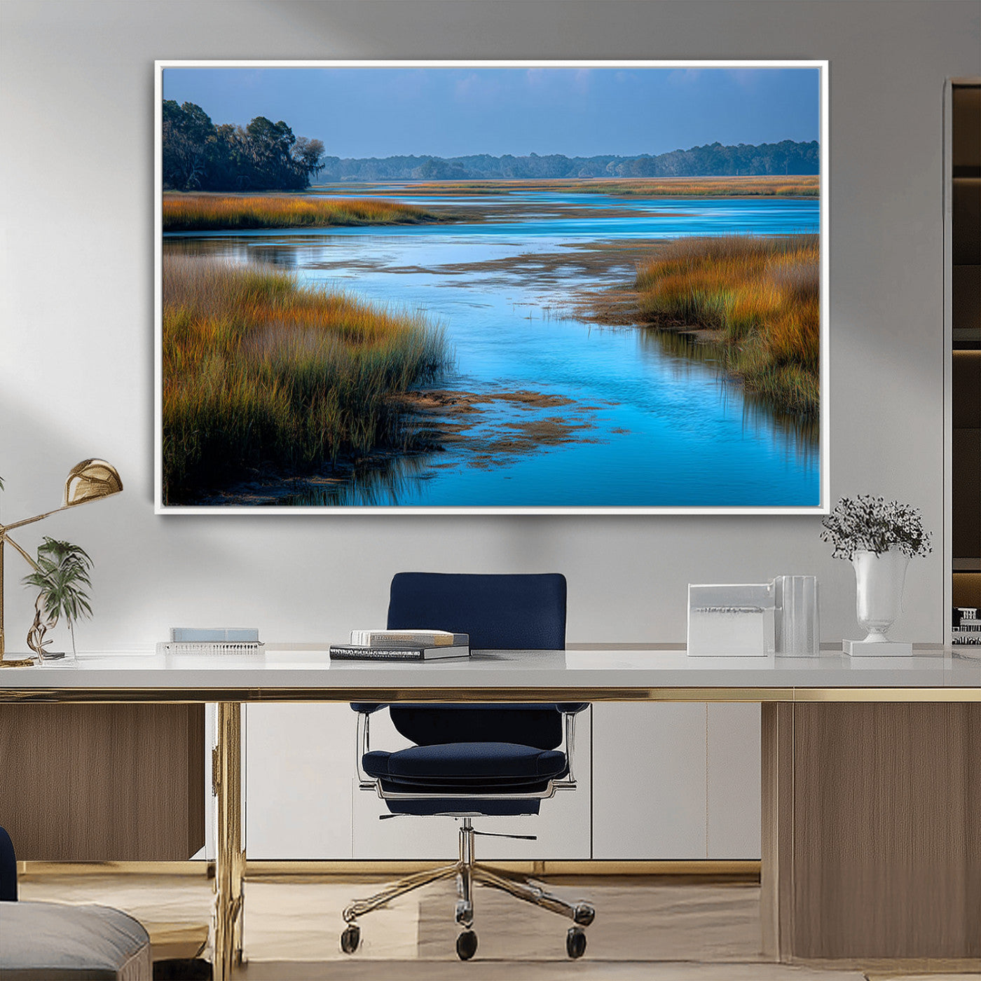 A peaceful marshland scene with calm blue water reflecting the surrounding grasses and trees, capturing the beauty of nature in a serene landscape.