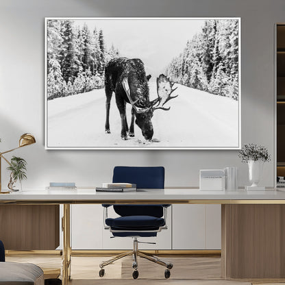 A majestic moose grazing in the snow-covered wilderness, surrounded by snow-covered trees, creating a peaceful winter scene.