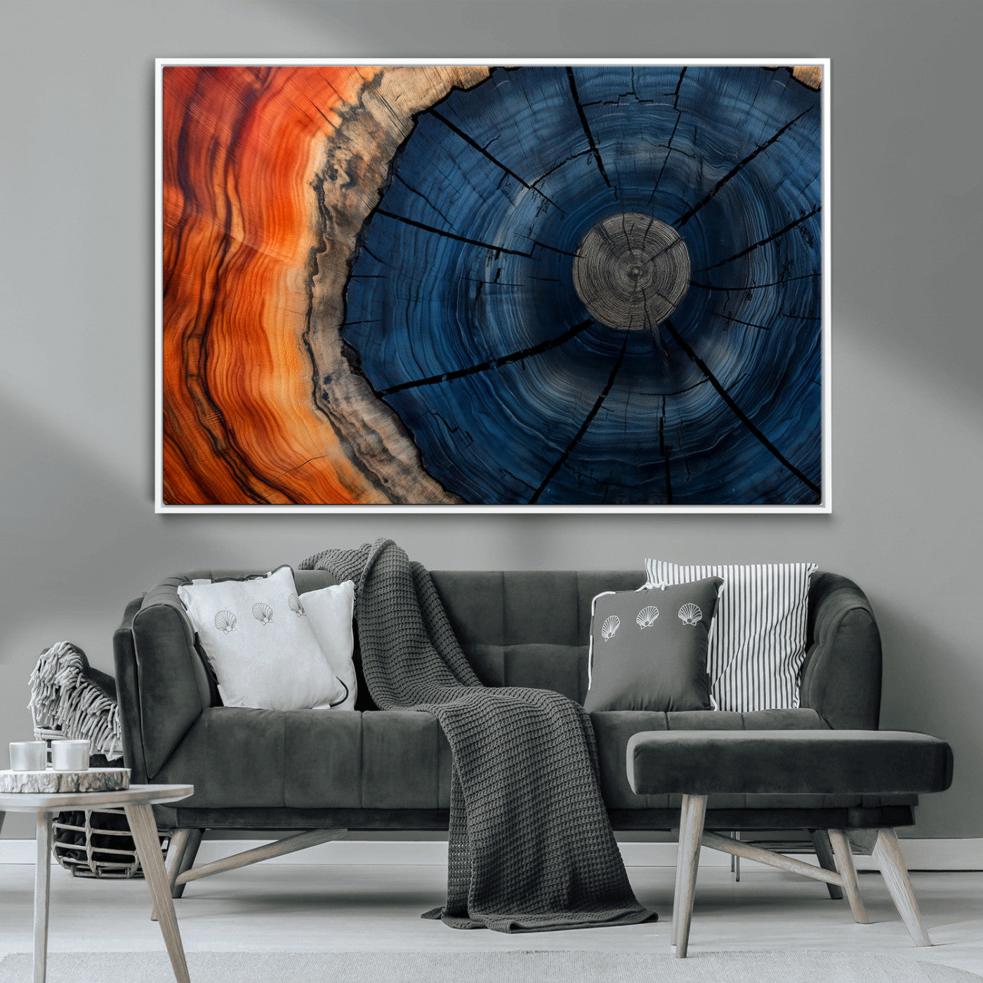 A captivating close-up of a tree trunk, showcasing its concentric rings in rich shades of blue, orange, and brown, highlighting the organic patterns of natural wood.