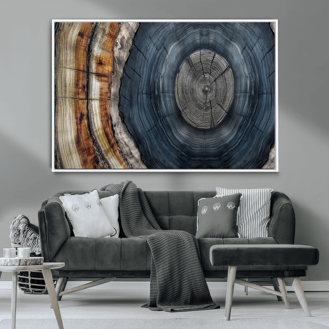 A stunning close-up of a tree trunk showing the intricate, circular growth rings, showcasing the natural textures and rich contrasts in deep blues, browns, and silvers.