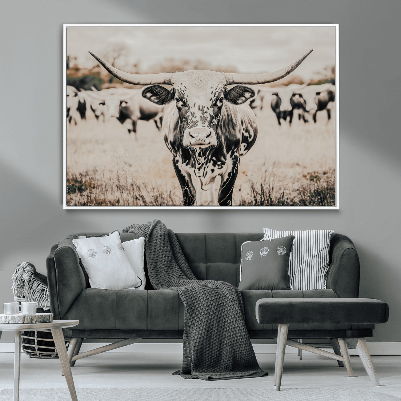 Canvas of a speckled Texas longhorn standing boldly in a field with a herd behind, perfect for rustic western or farmhouse wall decor.