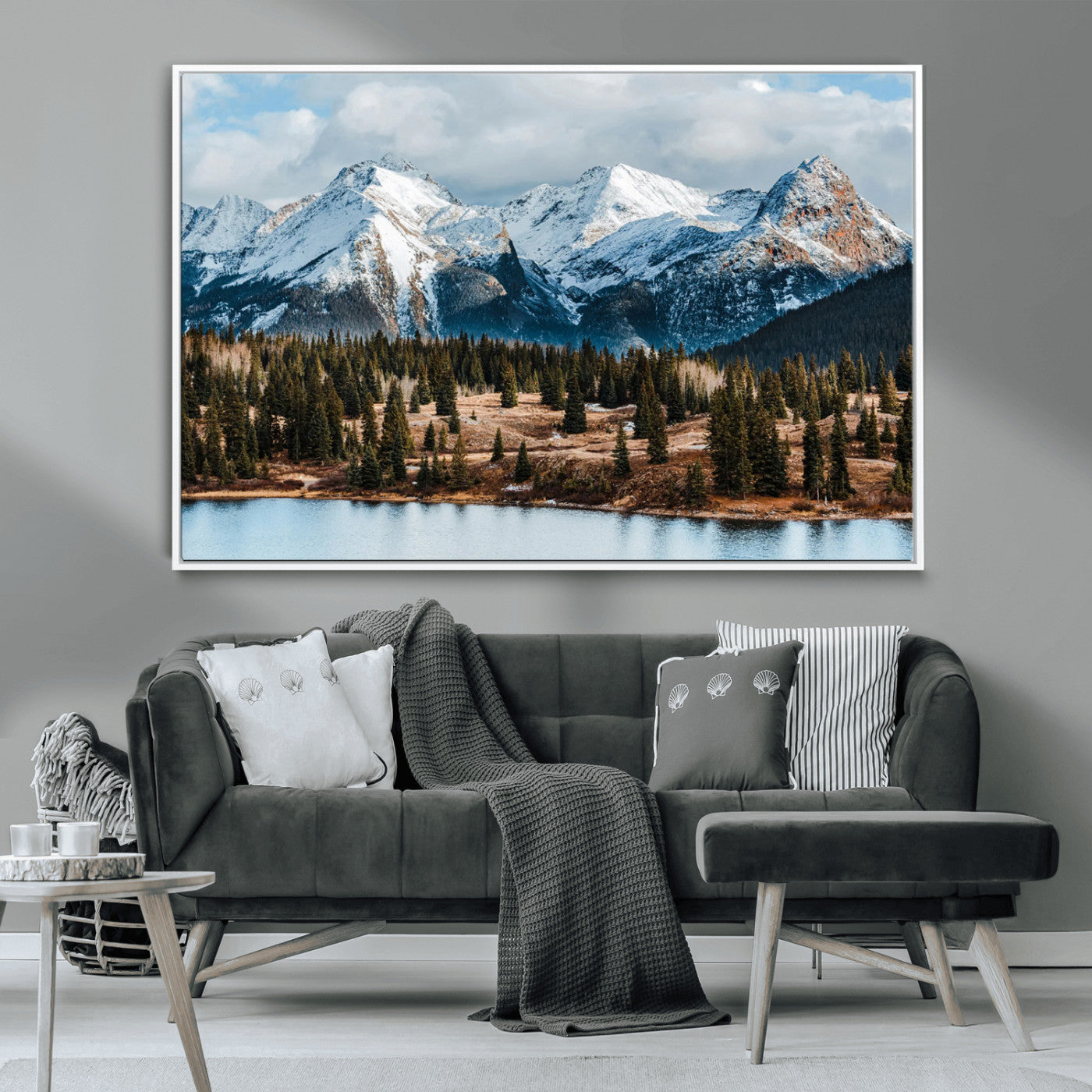 Framed canvas of snowy mountain peaks with pine forest and alpine lake, perfect for winter cabin or wilderness-inspired home decor.