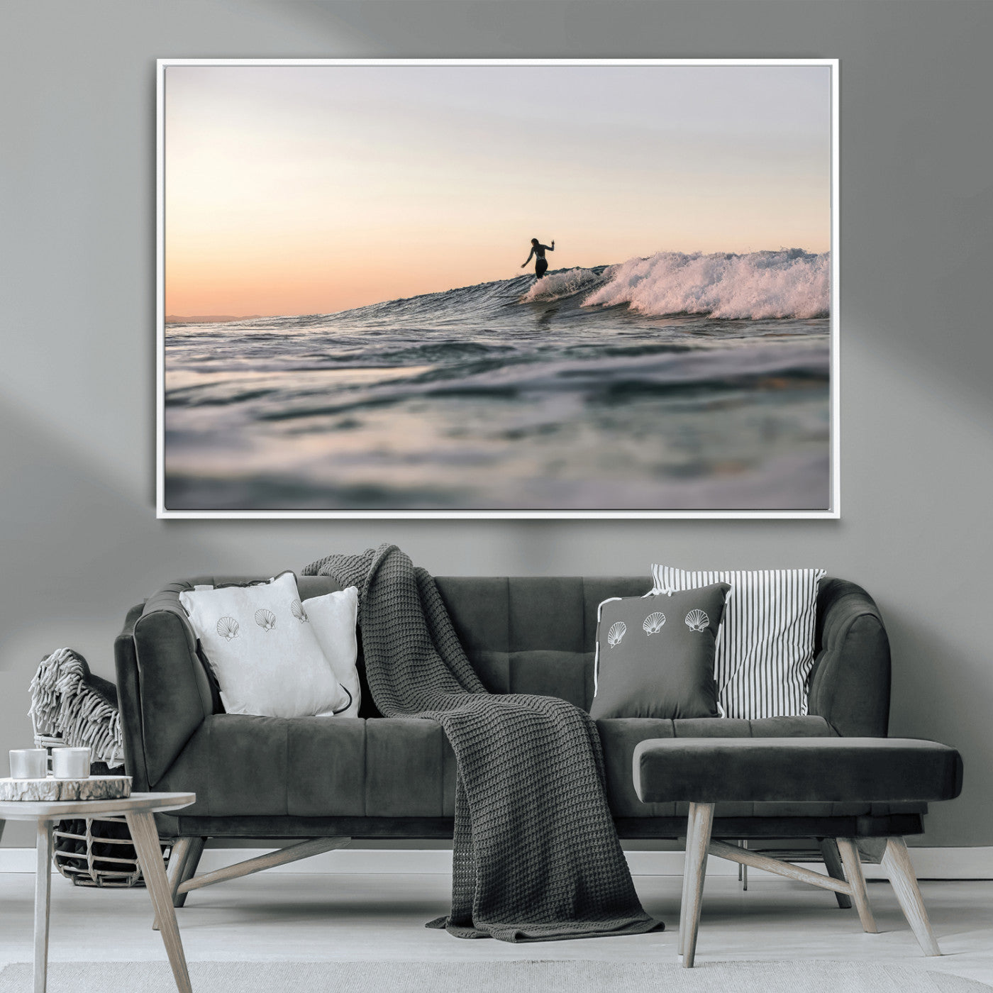 Framed canvas of a female surfer balancing on a wave at sunset, perfect for serene surf or ocean-inspired coastal decor.