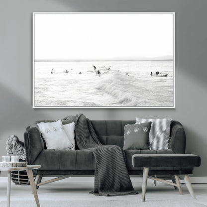 Monochrome photo of surfers riding and waiting on ocean waves, ideal for surf-themed or coastal energy wall decor.