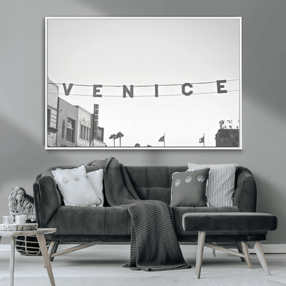 Black and white photo of Venice Beach sign and palm-lined street, perfect for urban coastal or minimalist LA-inspired wall decoration.