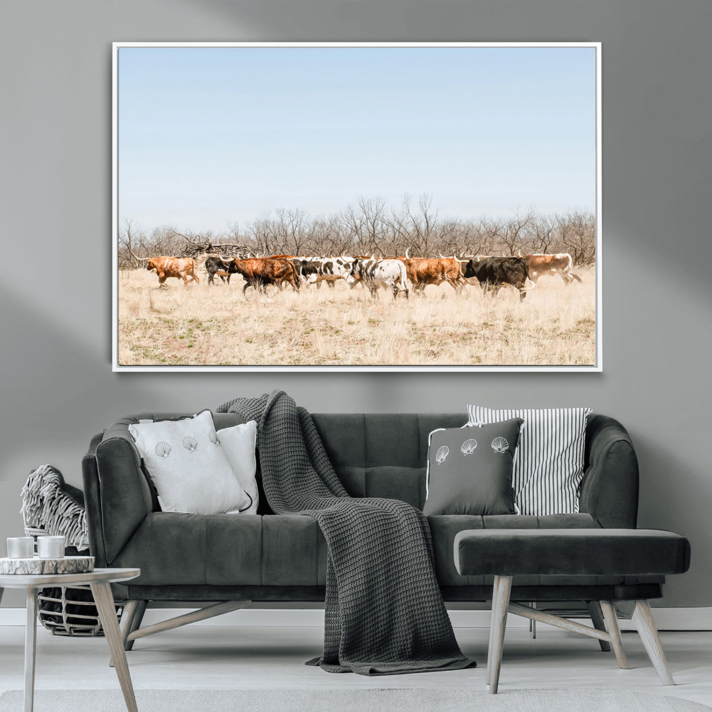 Framed wall art of Texas longhorn cattle walking through a dry, neutral-toned prairie, perfect for rustic farmhouse or western-themed home decor.