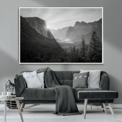 Black and white landscape of Yosemite with sun rays peeking over El Capitan, ideal for moody nature or modern rustic decor.