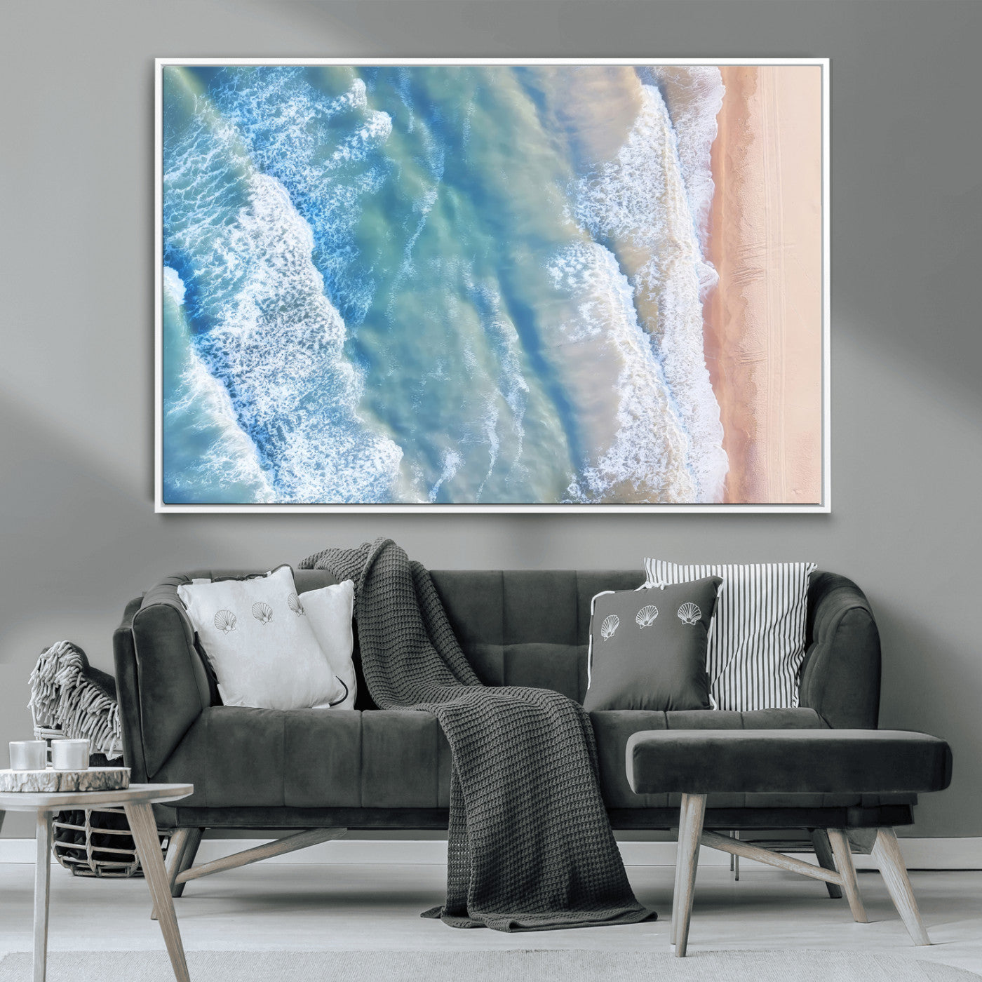 Aerial photo of soft blue waves meeting sandy shore, perfect for modern coastal or beach-themed decor with a light and tranquil aesthetic.