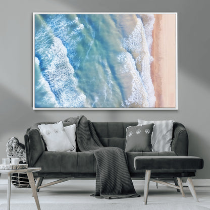 Aerial photo of soft blue waves meeting sandy shore, perfect for modern coastal or beach-themed decor with a light and tranquil aesthetic.