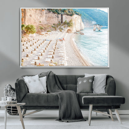 Wall art of a calm Mediterranean beach with rows of sun loungers and umbrellas in soft pastel tones, perfect for light coastal or vacation-themed decor.