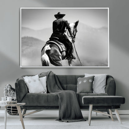 Black and white canvas of a cowboy on horseback with moody tones, perfect for rustic western or country-inspired home decor.