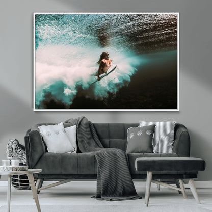 Vibrant underwater photo of a female surfer diving through turquoise waves, perfect for coastal boho or surf-inspired home decor.
