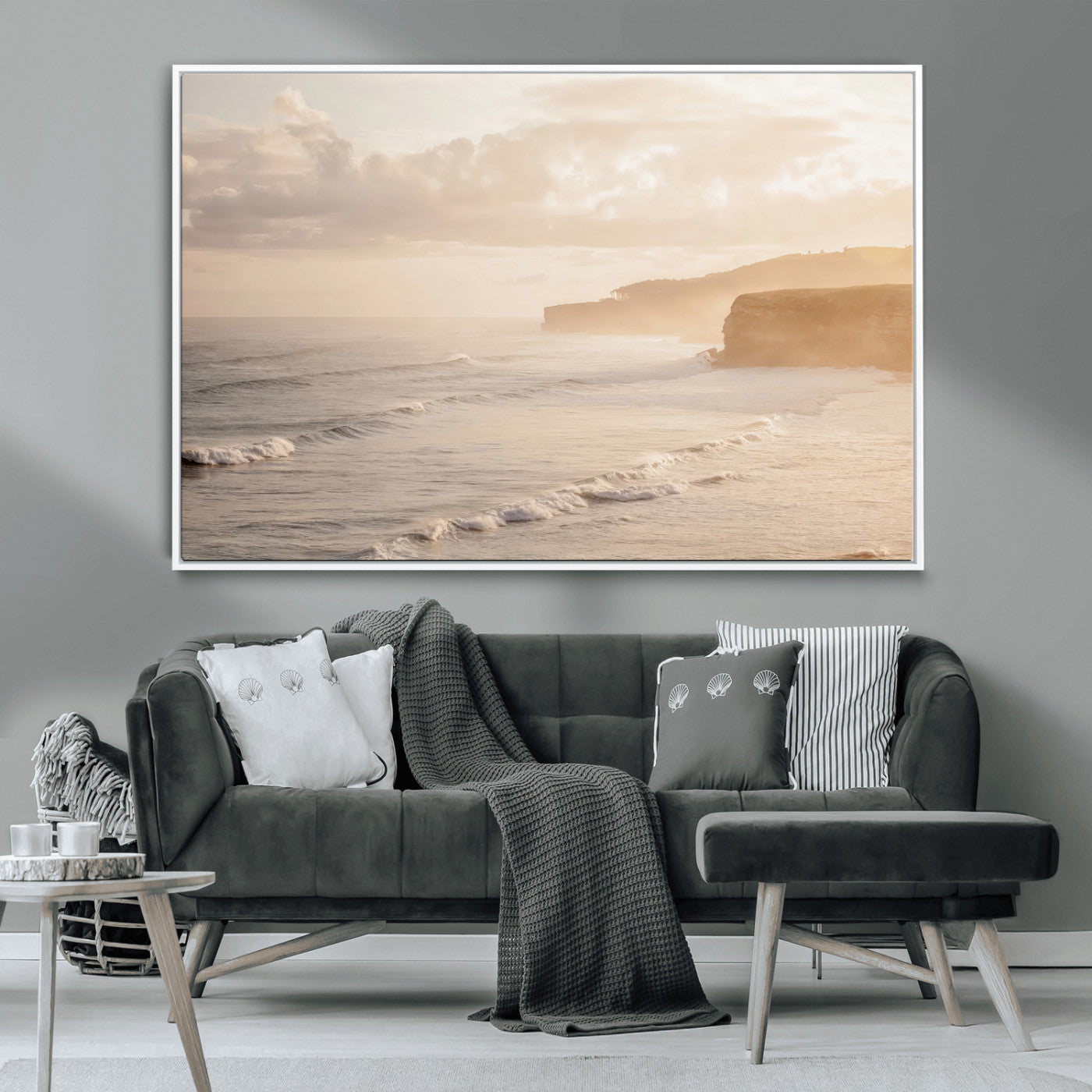 Golden hour seascape with misty cliffs and gentle waves rolling towards the shore, capturing a tranquil and warm coastal atmosphere.