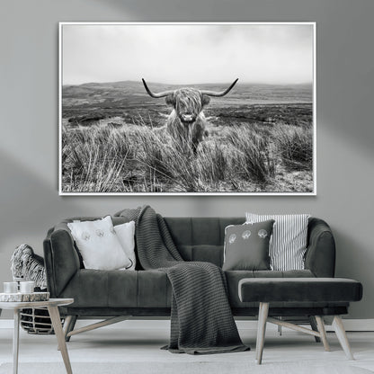 A black and white portrait of a Highland cow in a foggy Scottish countryside, capturing a rustic aesthetic and tranquil farm escape.