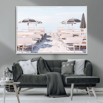 A serene minimalist beach scene featuring striped umbrellas, soft pastel sand, and an elegant lounge setup, creating a tranquil and stylish coastal retreat.