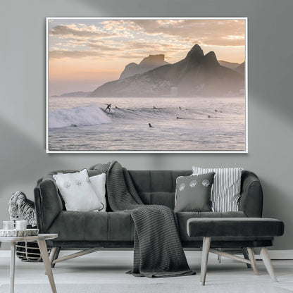 A surfer rides a golden hour wave near misty coastal mountains, surrounded by fellow surfers, capturing the spirit of a coastal adventure.
