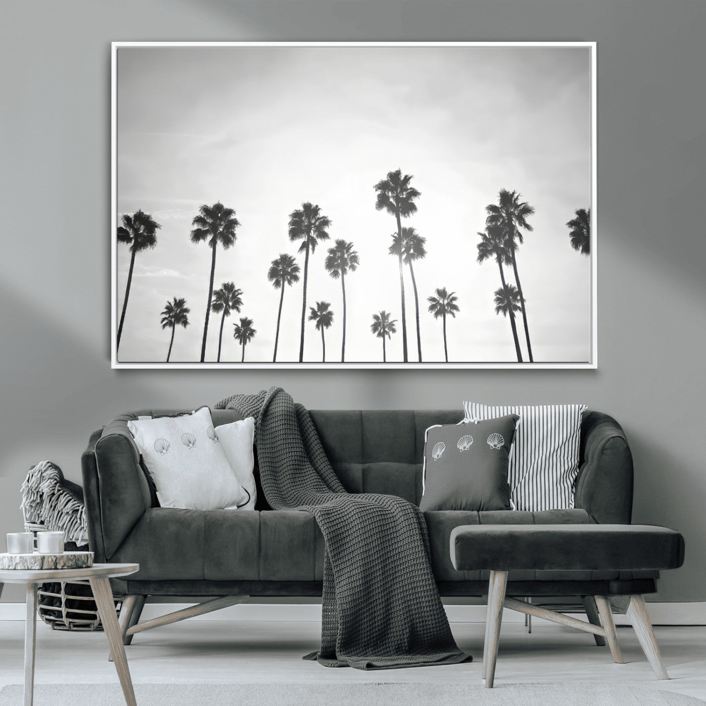 A black and white minimalist scene featuring tall palm trees silhouetted against a bright sky, creating a dreamy and timeless tropical aesthetic.