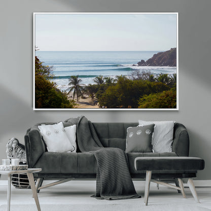 View of calm ocean waves with palm trees and a tropical coastline, ideal for coastal boho or beach-themed wall decor.
