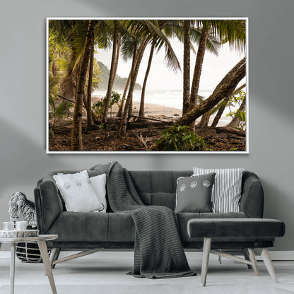 Dense tropical palm trees framing a sandy beach and ocean shore, ideal for jungle or coastal themed interior wall decor.