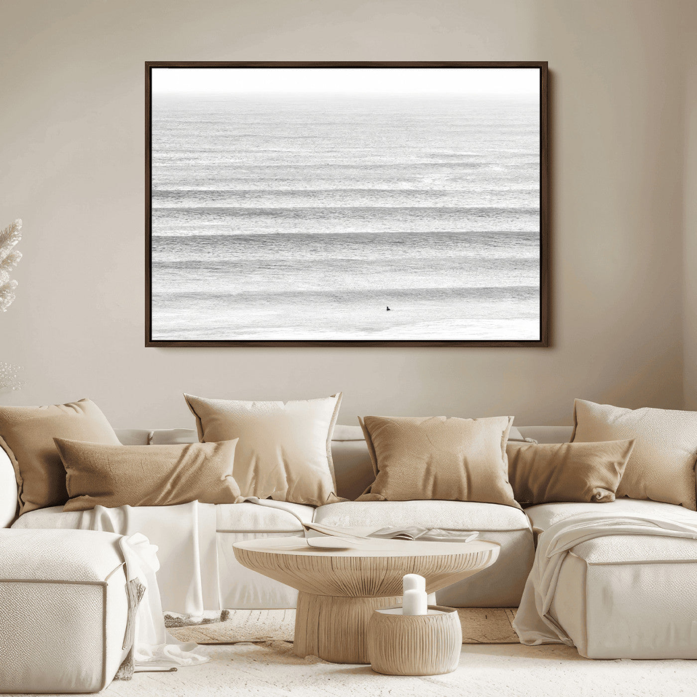 Monochrome photo of a lone surfer in calm layered waves, perfect for minimalist coastal or moody ocean-inspired wall decoration.