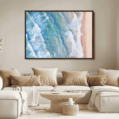 Aerial photo of soft blue waves meeting sandy shore, perfect for modern coastal or beach-themed decor with a light and tranquil aesthetic.