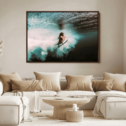 Vibrant underwater photo of a female surfer diving through turquoise waves, perfect for coastal boho or surf-inspired home decor.