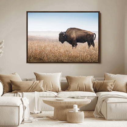 A majestic bison standing in an open prairie field, its strong form blending into the golden grass under a vast blue sky, evoking the wild spirit of the American plains.