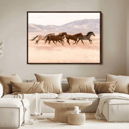 A herd of wild horses galloping through a sunlit desert plain with mountains in the background, perfect for rustic or western-themed wall decor.