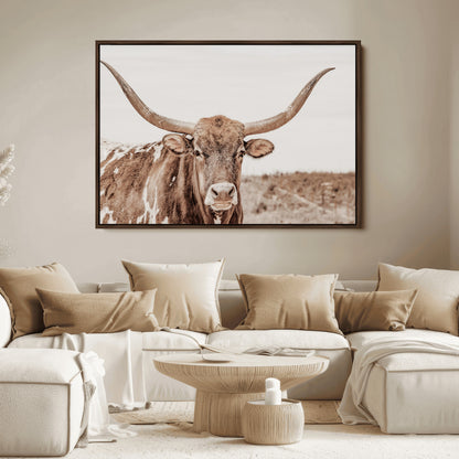 A longhorn cow in soft beige desert tones, standing calmly in open land, perfect for neutral western or rustic farmhouse interiors.