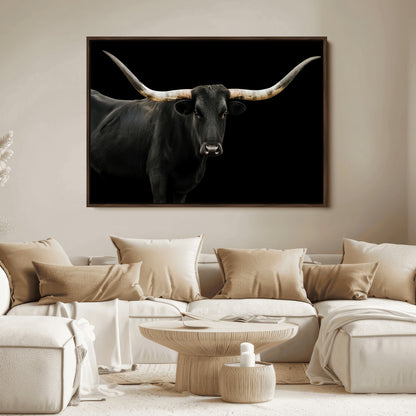 Close-up of a black Texas longhorn with large curved horns on black background, ideal for rustic farmhouse or modern western interiors.