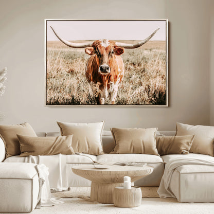 Framed longhorn cow canvas wall art with rustic prairie background, western animal print perfect for farmhouse or ranch style decor