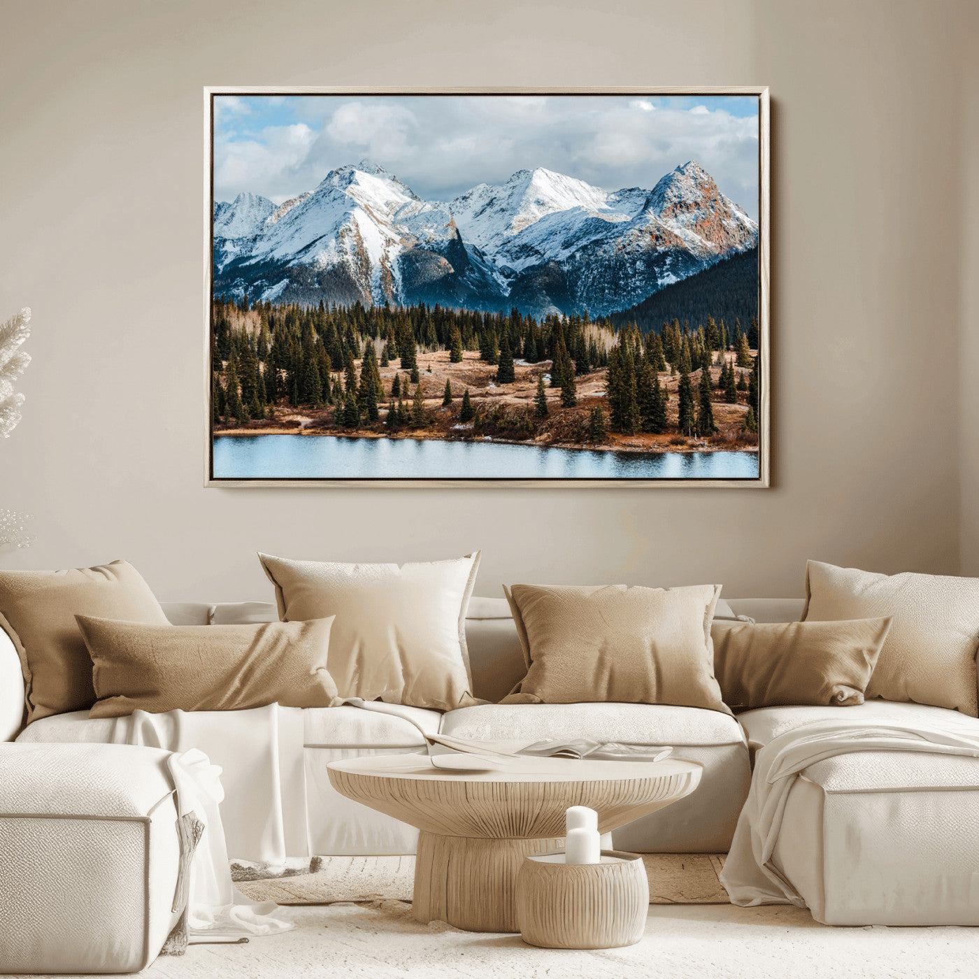 Framed canvas of snowy mountain peaks with pine forest and alpine lake, perfect for winter cabin or wilderness-inspired home decor.