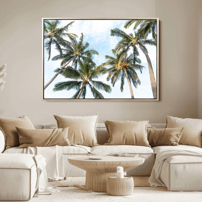 Framed canvas of tall palm trees reaching into a tropical sky, ideal for beach home or relaxed island-inspired wall decor.