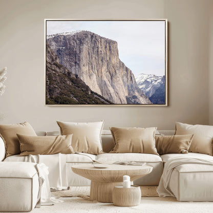 Framed canvas of El Capitan’s vertical granite face in Yosemite with snowy peaks, ideal for Sierra minimalism or mountain-inspired decor.