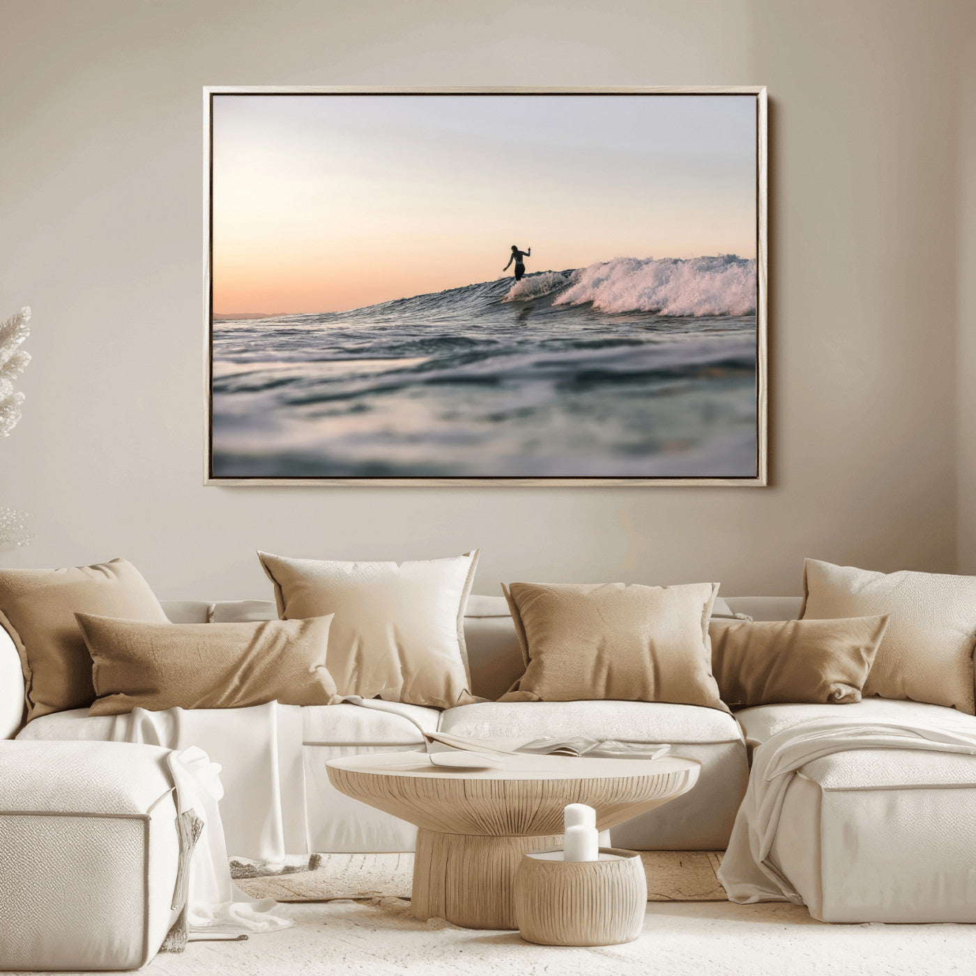 Framed canvas of a female surfer balancing on a wave at sunset, perfect for serene surf or ocean-inspired coastal decor.