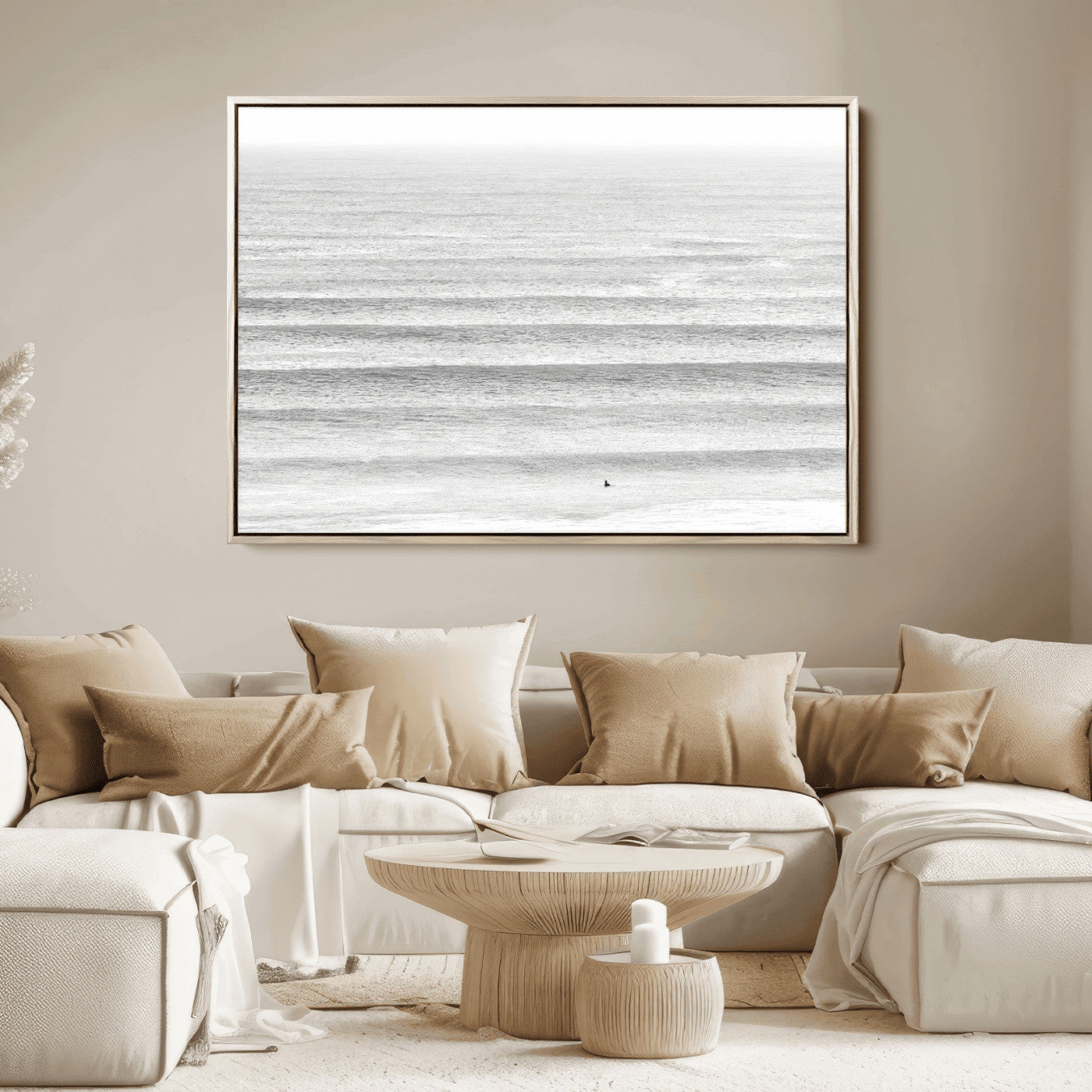 Monochrome photo of a lone surfer in calm layered waves, perfect for minimalist coastal or moody ocean-inspired wall decoration.