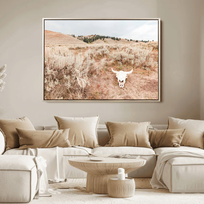 Rustic bull skull on dry sagebrush field under soft light, ideal for western minimal or desert prairie-style wall decoration.
