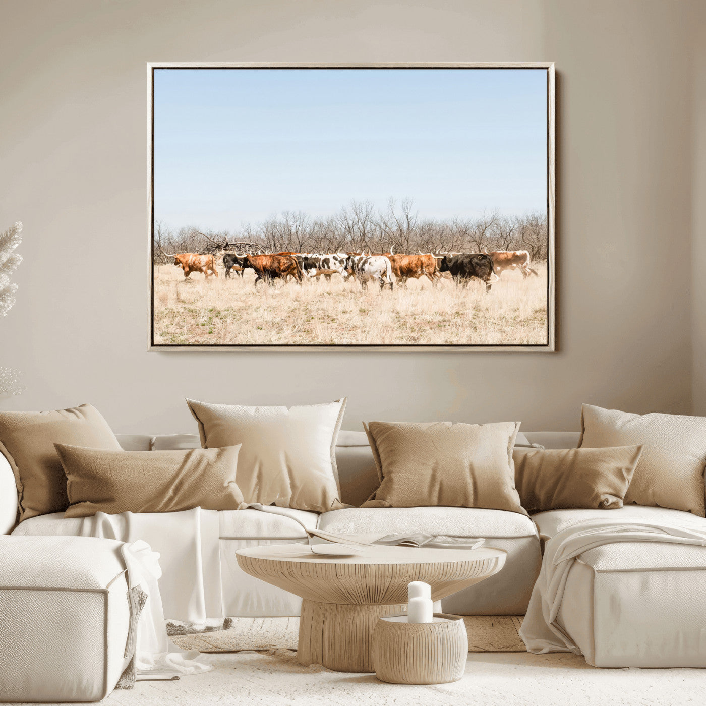 Framed wall art of Texas longhorn cattle walking through a dry, neutral-toned prairie, perfect for rustic farmhouse or western-themed home decor.