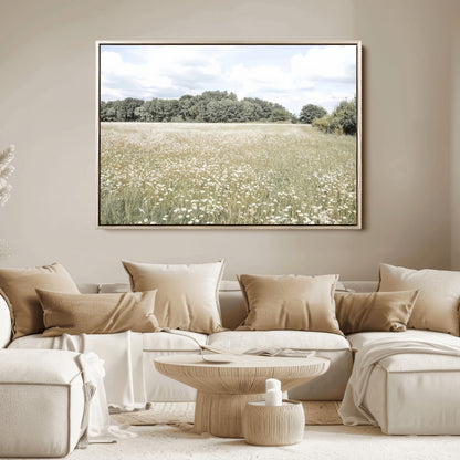 Soft-toned image of a wild daisy field under a cloudy sky, ideal for neutral or Scandinavian-inspired home decor.