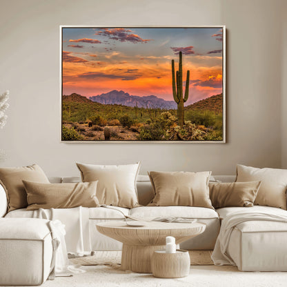 Vibrant desert sunset with saguaro cacti and distant mountains, perfect for Southwestern or warm-toned home decor.
