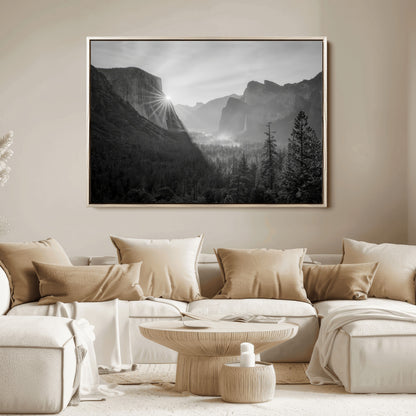 Black and white landscape of Yosemite with sun rays peeking over El Capitan, ideal for moody nature or modern rustic decor.
